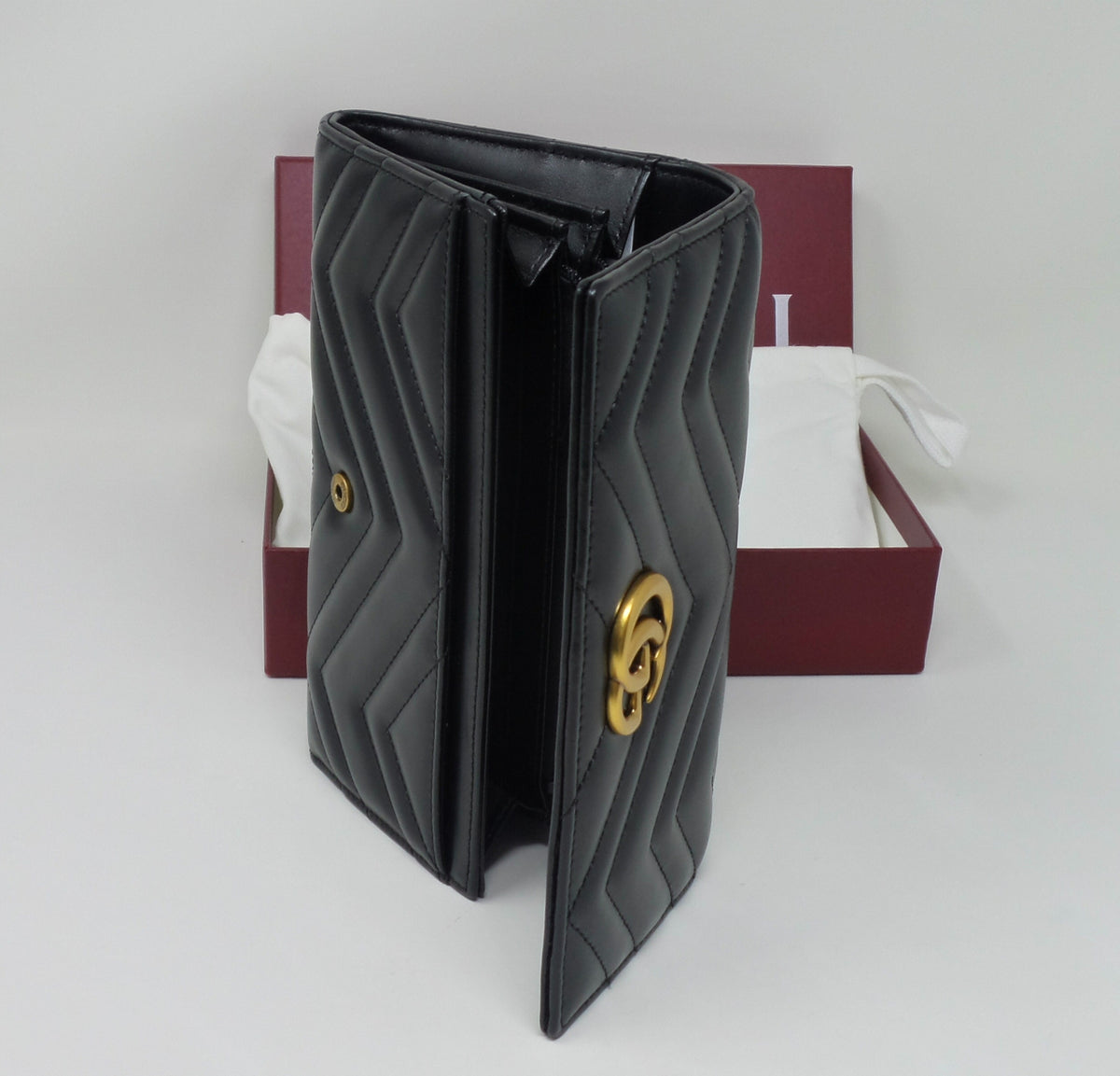 Black Leather Continental Wallet with Matte Brass Marmont G