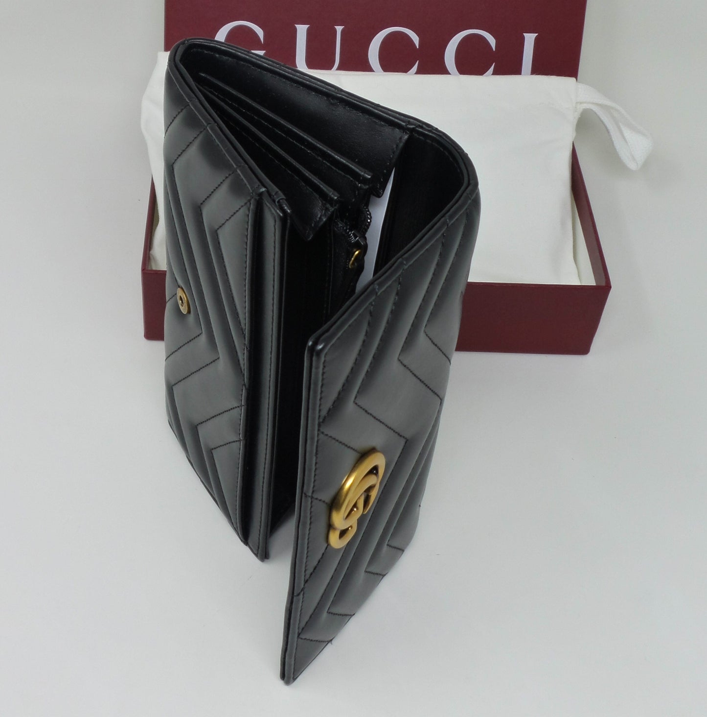 Black Leather Continental Wallet with Matte Brass Marmont G