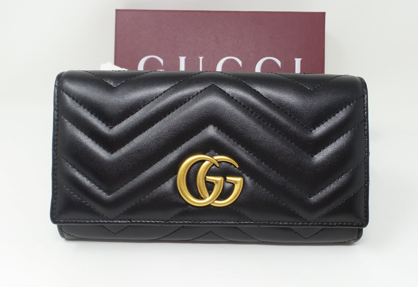 Black Leather Continental Wallet with Matte Brass Marmont G